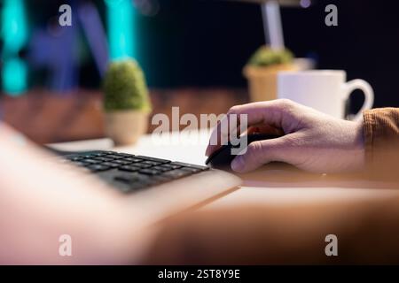 Teleworking computer technician typing on keyboard, implementing security measures to protect company systems and data. Remote IT employee at home debugging code for software, close up Stock Photo
