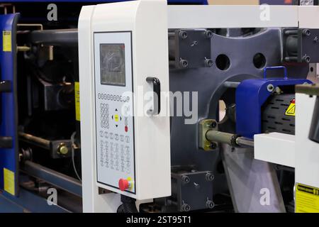 Closeup of plastic injection molding press machine. Selective focus. Stock Photo