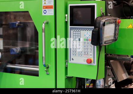 Control panel of plastic injection molding machine close up. Selective focus. Stock Photo