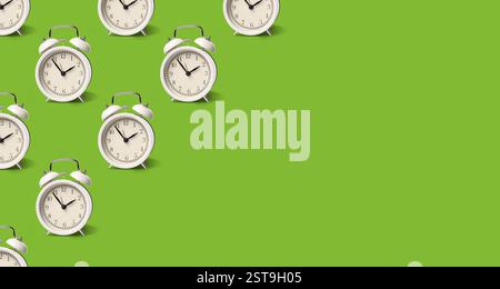 White alarm clocks on light green background, pattern. Banner design with space for text Stock Photo