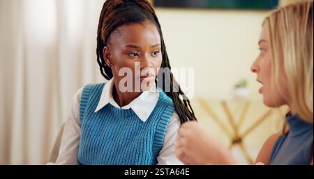 Business people, conversation and women in office, planning and teamwork for project. Editor, coaching and employees in workplace, mentor and advice Stock Photo