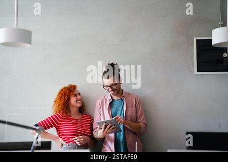 Software, coding and business woman on tablet thinking of data analytics, digital technology. Stock Photo