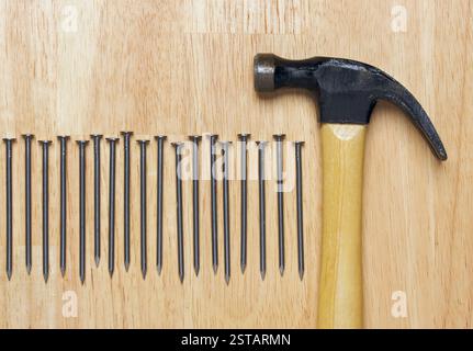 Hammer and Nails Abstract on Wood Background. Stock Photo