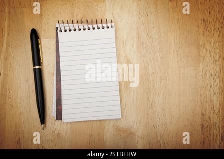 Note Pad and Pen on Wood Stock Photo