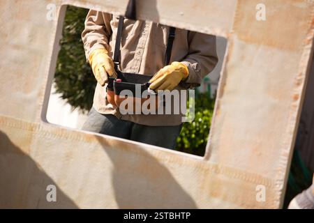 Utility Worker Using Remote Crane Controller Stock Photo