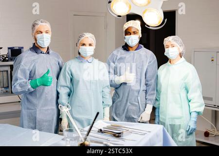 Group of doctors discussing patient cases around table. Stock Photo