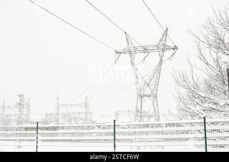 A pylon behind a substation Stock Photo - Alamy