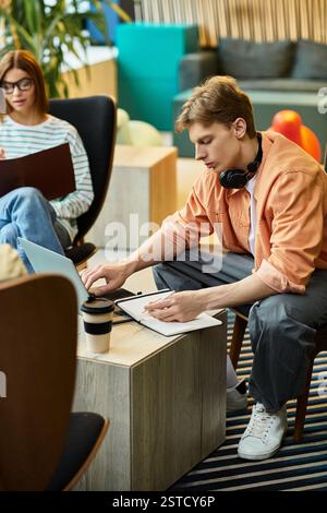 Colleagues engaged in work activities in a bright hotel lounge, each focused and productive. Stock Photo
