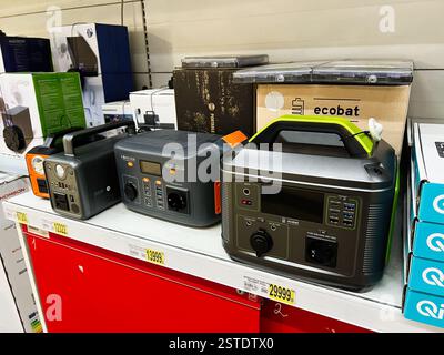 Lviv, Ukraine - February 16, 2025: Various portable power stations, including battery-based, showcased in a hardware retail store Stock Photo