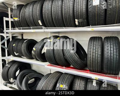Lviv, Ukraine - February 16, 2025: Lviv, Ukraine - February 16, 2025: Various car tires displayed on store shelves, organized and ready for sale Stock Photo