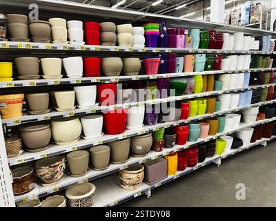 Lviv, Ukraine - February 16, 2025: Vibrant variety of plant pots arranged neatly on store shelves Stock Photo