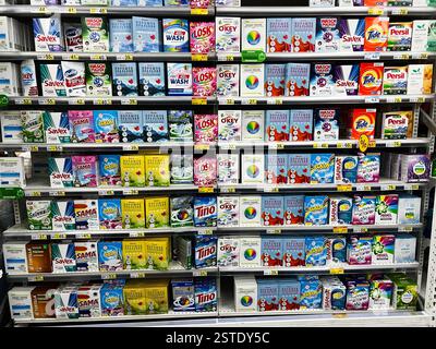 Lviv, Ukraine - February 16, 2025: Colorful selection of laundry detergents and soaps on supermarket shelves Stock Photo