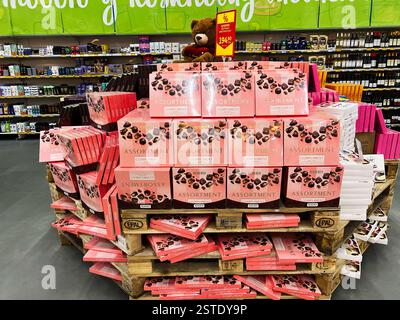 Lviv, Ukraine - February 16, 2025: Large pile of assorted chocolates displayed in a retail store under special offers Stock Photo