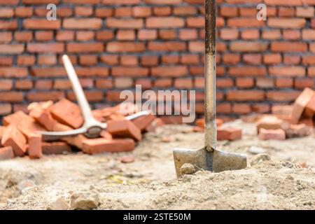 Shovel and pickaxe on a construction site Stock Photo
