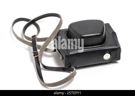 Black camera case with strap on white background. Closeup Stock Photo