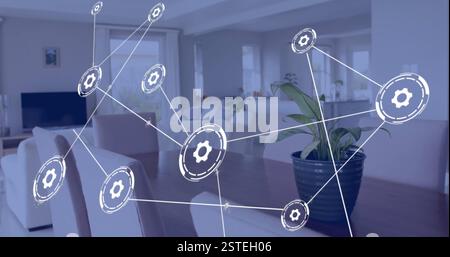 Gear icons connected by lines, network technology image over modern living room Stock Photo