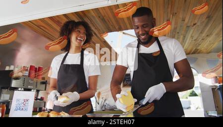 Preparing food, two chefs in kitchen with hot dog image Stock Photo