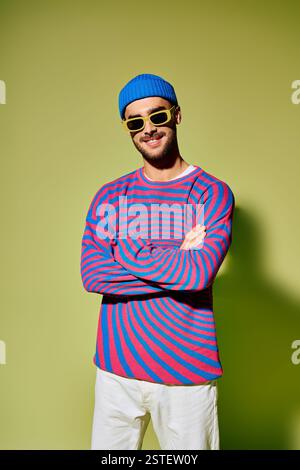 A handsome young man confidently displays his fashion sense with a bold ...