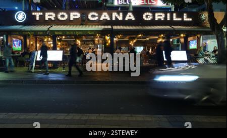 Night shot of the Tropicana Grill restaurant on the seafront strip at Avenue de las Playas, Puerto del Carmen. Stock Photo