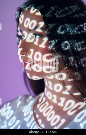 Binary machine code. Beautiful young woman is in projector neon lights in the studio. Stock Photo
