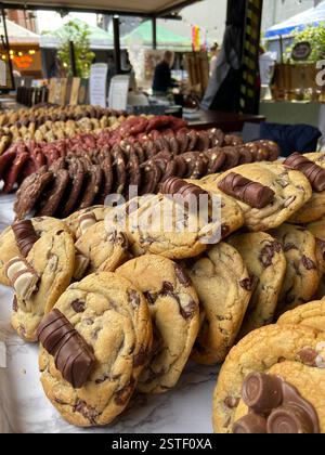 Delicious freshly baked cookies topped with chocolate bars at a market in Howth, Ireland. A sweet treat by the seaside. Stock Photo
