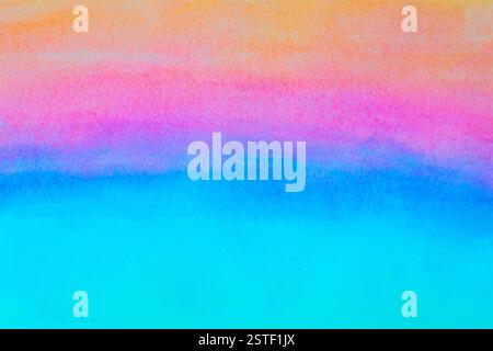 Vivid watercolor gradient blending blue, pink, and orange hues on textured paper Stock Photo