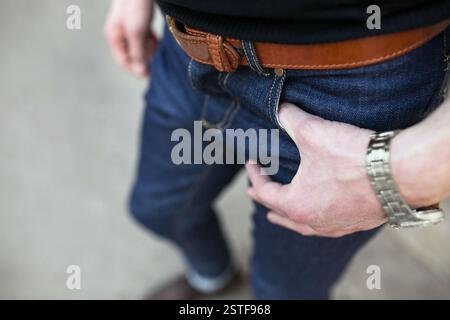 Confident man posing in selvedge  jeans Stock Photo