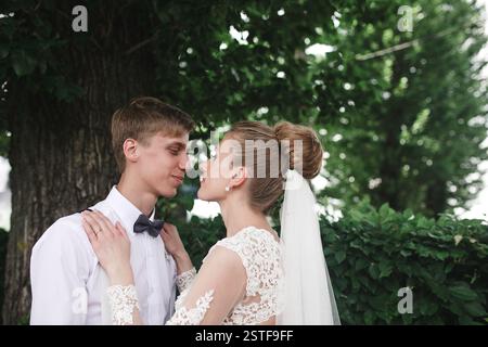 Bride and groom in the park Stock Photo