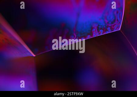 Purple liquid pattern on black background, fluid motion, dark horror background, liquid in macro, flat gradient Stock Photo