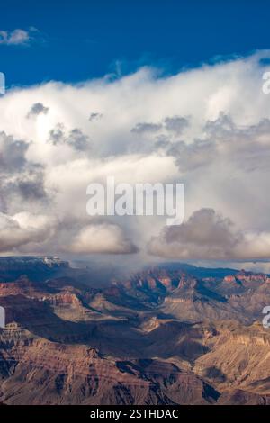 Clouds over the Grand Canyon in Grand Canyon National Park, Arizona, USA. The canyon is 445 kilometers long, 29 kilometres wide, and over 1.6 kilometres deep. This geological landform attracts millions of visitors annually. Stock Photo