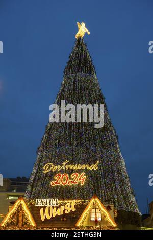 Large Christmas tree with coloured lights and angel on top, Christmas market, Dortmund, North Rhine-Westphalia, Germany, Europe Stock Photo