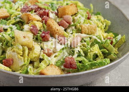Brussels sprouts Caesar salad, with bacon and croutons, healthy food, homemade, no people Stock Photo