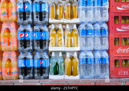 Detail, close up of a stack of soft drink, soda plastic bottles, including Pepsi, Frutta, Mir Hayat Water. In Samarkand, Uzbekistan. Stock Photo