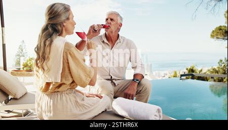 Travel, drinking and mature couple with alcohol, relax and celebration of anniversary with liquor and outdoor. Bonding, man and woman with wine on Stock Photo