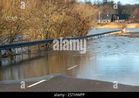 Refugee  silouettes on a bridge in sunrice. Stock Photo