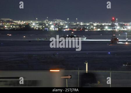 Toronto, Canada.18th February 2025. The wreckage of a Delta Air Lines-operated CRJ900 aircraft lays on the runway at Toronto Pearson International Airport on February 18, 2025 in Toronto, Canada. A Delta Air Lines flight from Minneapolis crashed, turned upside down and caught fire on the runway at Toronto Pearson International Airport while attempting to land on February 17. Credit: Yu Ruidong/China News Service/Ģ����ý Live News Stock Photo