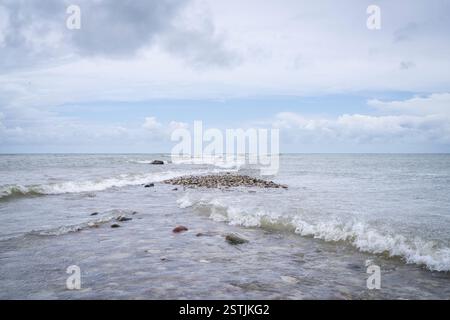 Sea view with cross waves on a cloudy day. Cross Sea. Square waves. Stock Photo