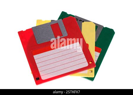A stack of vintage computer colored floppy disks Isolated on white. Old technologies. Selective focus Stock Photo