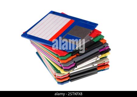 A stack of vintage computer colored floppy disks Isolated on white. Old technologies. Selective focus Stock Photo