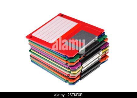 A stack of vintage computer colored floppy disks Isolated on white. Old technologies. Selective focus Stock Photo