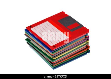 A stack of vintage computer colored floppy disks Isolated on white. Old technologies. Selective focus Stock Photo