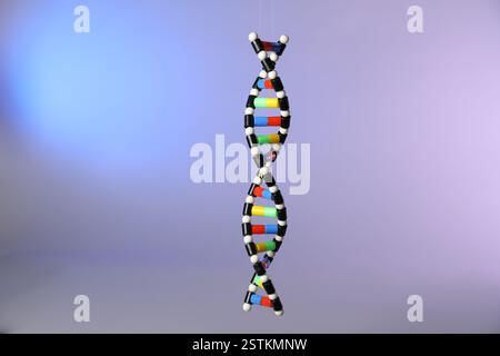 One DNA structure model on color background Stock Photo
