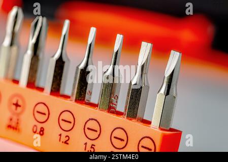 Detail of flathead magnetic precision screwdriver bits on white background Stock Photo