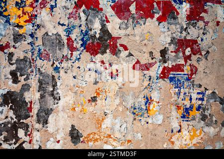 Bumpy plastered wall covered with mess of color spots Stock Photo
