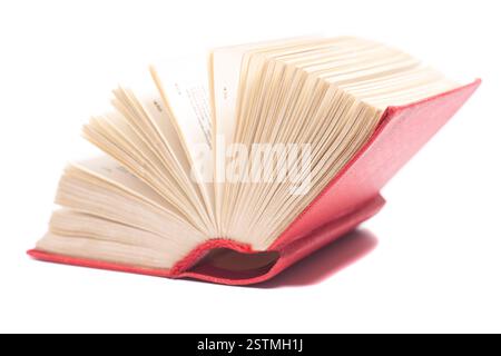 Open red book isolated on white background. Stock Photo
