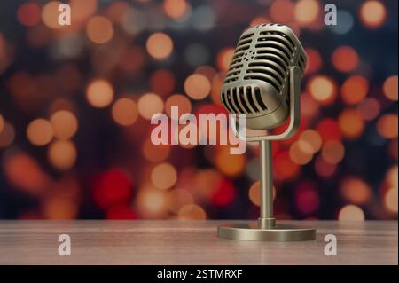 A vintage-style microphone on a stand, set against a blurred background of warm, glowing lights. Copy space for text. Stock Photo