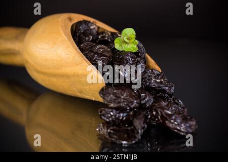 Natural dried plums close-up in macro photography. Stock Photo