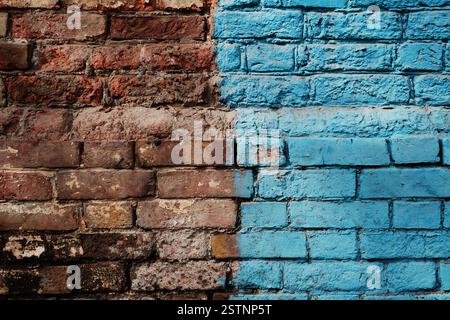 Weathered Half Painted In Blue Brick Wall Stock Photo