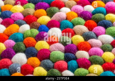 Multicolored felt ball rug detail Stock Photo