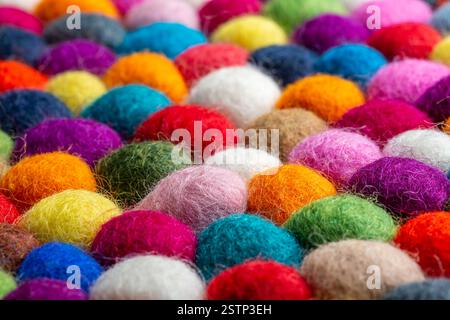 Multicolored felt ball rug detail Stock Photo